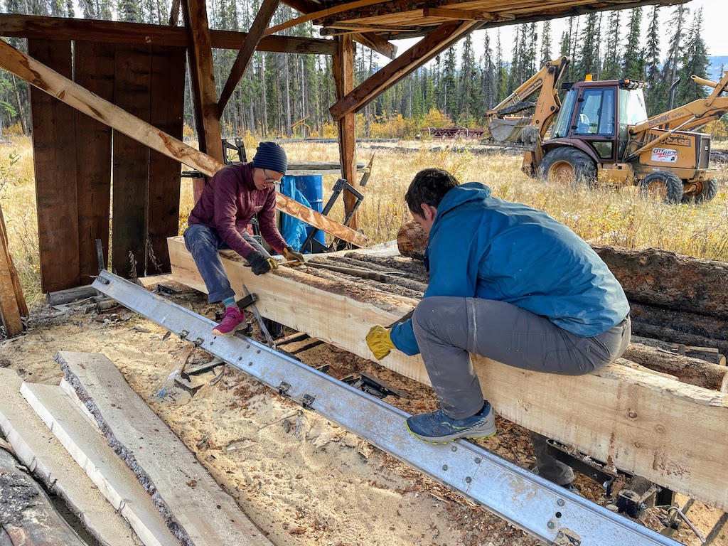 Milling logs for a bridge that the neighbor Vern was building. The trees were felled on the neighboring property.